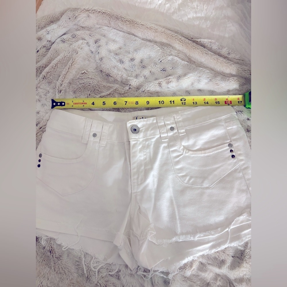 White Jean Short Shorts. Great Pocket Design Grommets Size Medium.